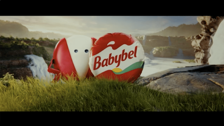 Two Babybel mini cheeses with a dramatic waterfalls scenary